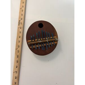 Vintage African Kalimba thumb piano with wooden board and metal tines